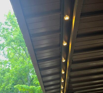 Permanent lighting track hidden in daytime soffit