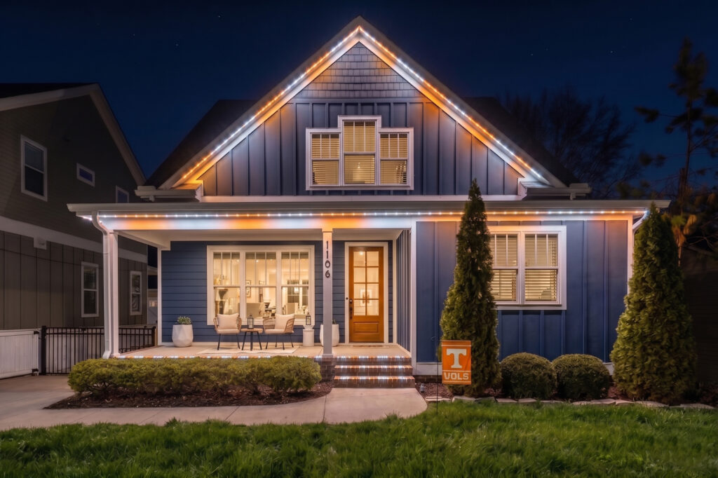 Permanent holiday lighting in orange and white on a Middle Tennessee home